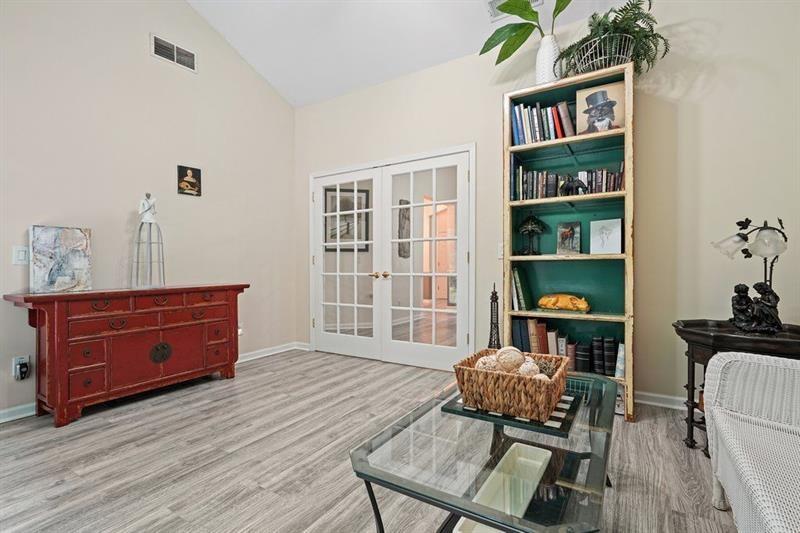2521 Eden Ridge Lane, Unit 7 Acworth, GA 30101 - Photo 30 of 47 a room with furniture window and wooden floor