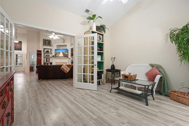 2521 Eden Ridge Lane, Unit 7 Acworth, GA 30101 - Photo 31 of 47 a living room with furniture and a wooden floor