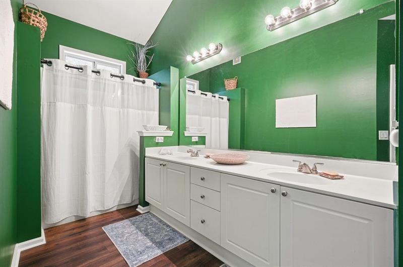 2521 Eden Ridge Lane, Unit 7 Acworth, GA 30101 - Photo 35 of 47 a bathroom with a double vanity sink and mirror