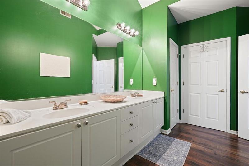 2521 Eden Ridge Lane, Unit 7 Acworth, GA 30101 - Photo 36 of 47 a bathroom with a double vanity sink and mirror