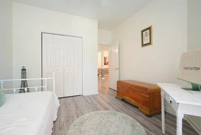 a bedroom with a bed and a table