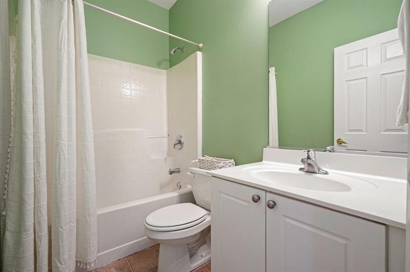 2521 Eden Ridge Lane, Unit 7 Acworth, GA 30101 - Photo 40 of 47 a bathroom with a sink a toilet and shower