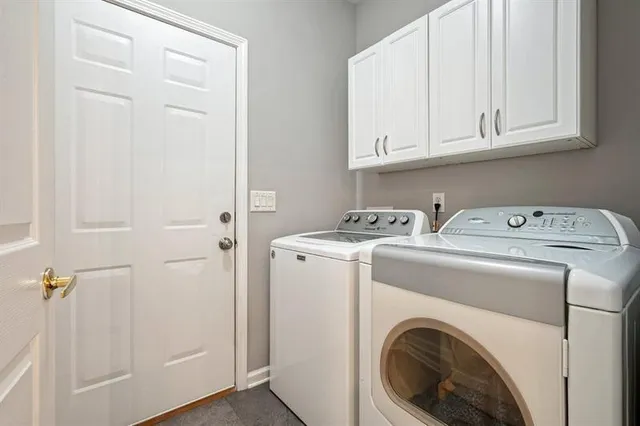 a view of storage and utility room with washer and dryer