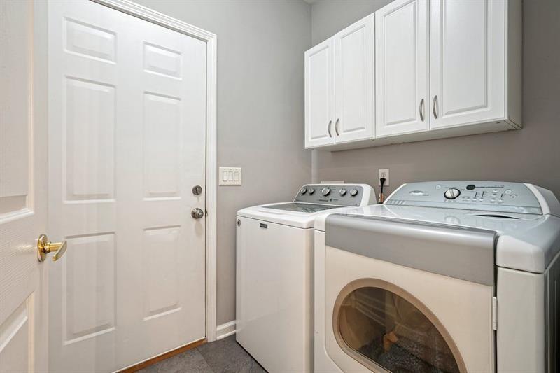 2521 Eden Ridge Lane, Unit 7 Acworth, GA 30101 - Photo 41 of 47 a view of storage and utility room with washer and dryer