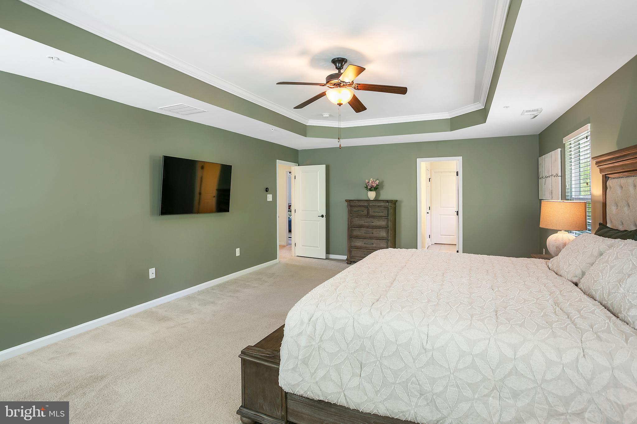 10576 Long Leaf Lane Waldorf, MD 20603 - Photo 17 of 54 a bedroom with a bed and a flat screen tv