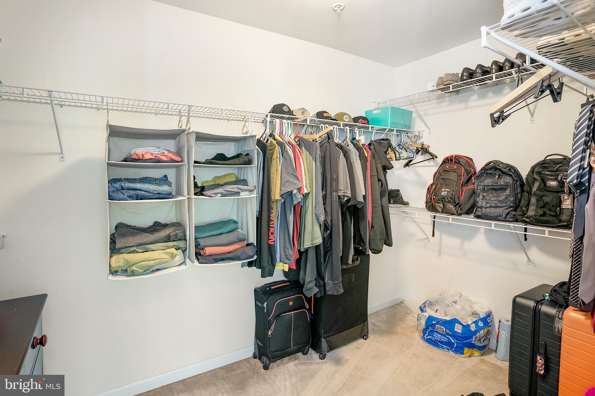 10576 Long Leaf Lane Waldorf, MD 20603 - Photo 21 of 54 a view of walk in closet with clothes and shoes
