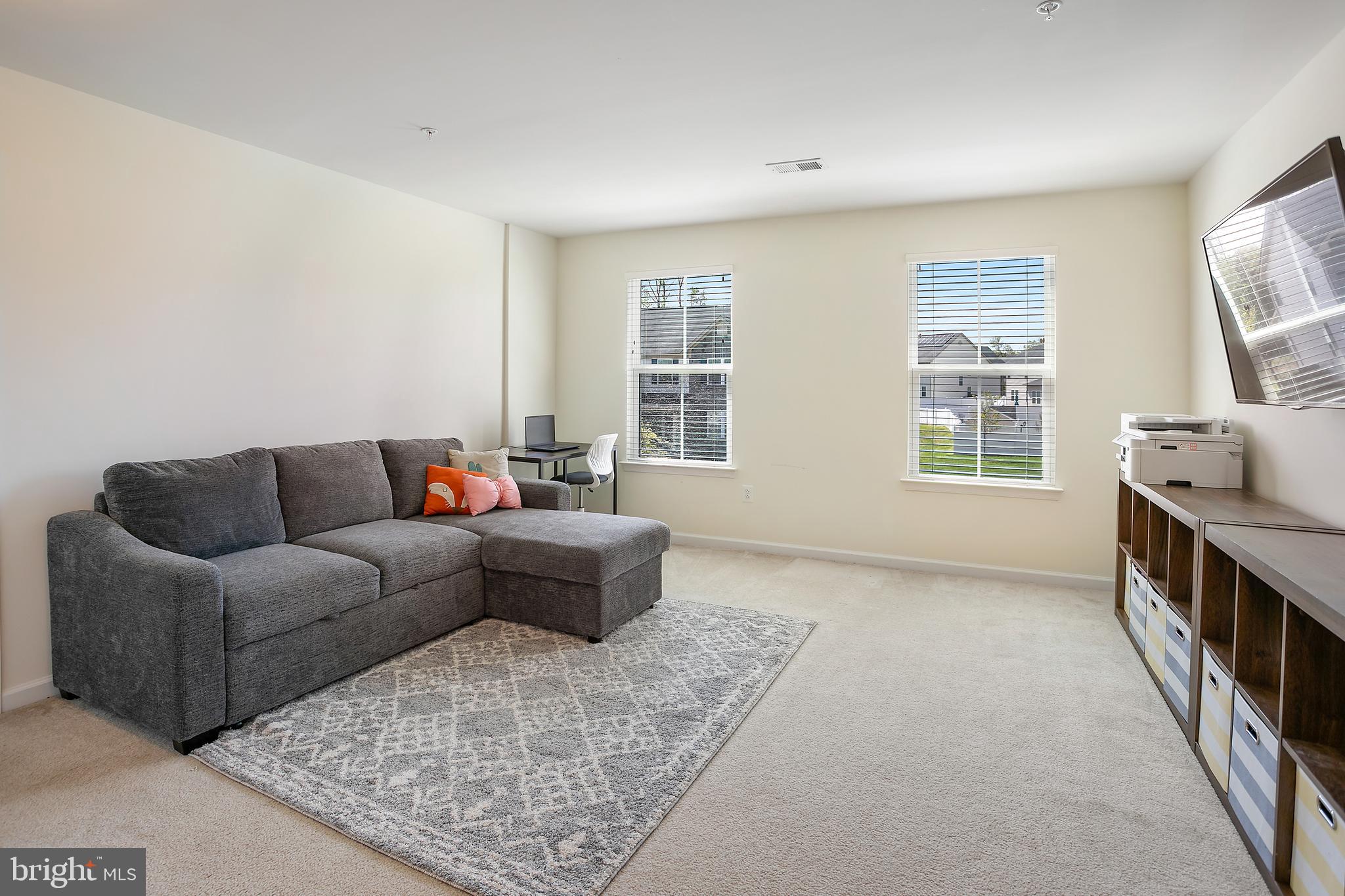 10576 Long Leaf Lane Waldorf, MD 20603 - Photo 25 of 54 a living room with furniture and a flat screen tv