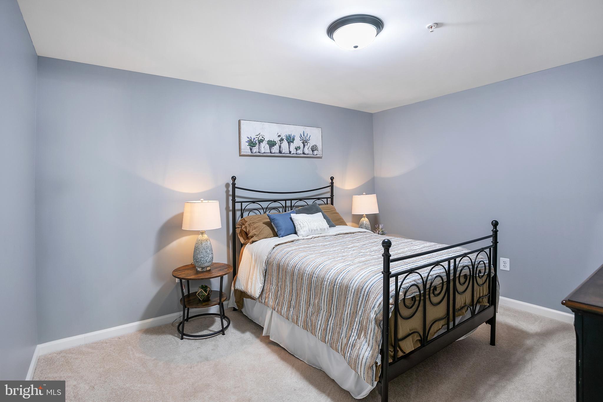 10576 Long Leaf Lane Waldorf, MD 20603 - Photo 35 of 54 a bedroom with a bed and a table