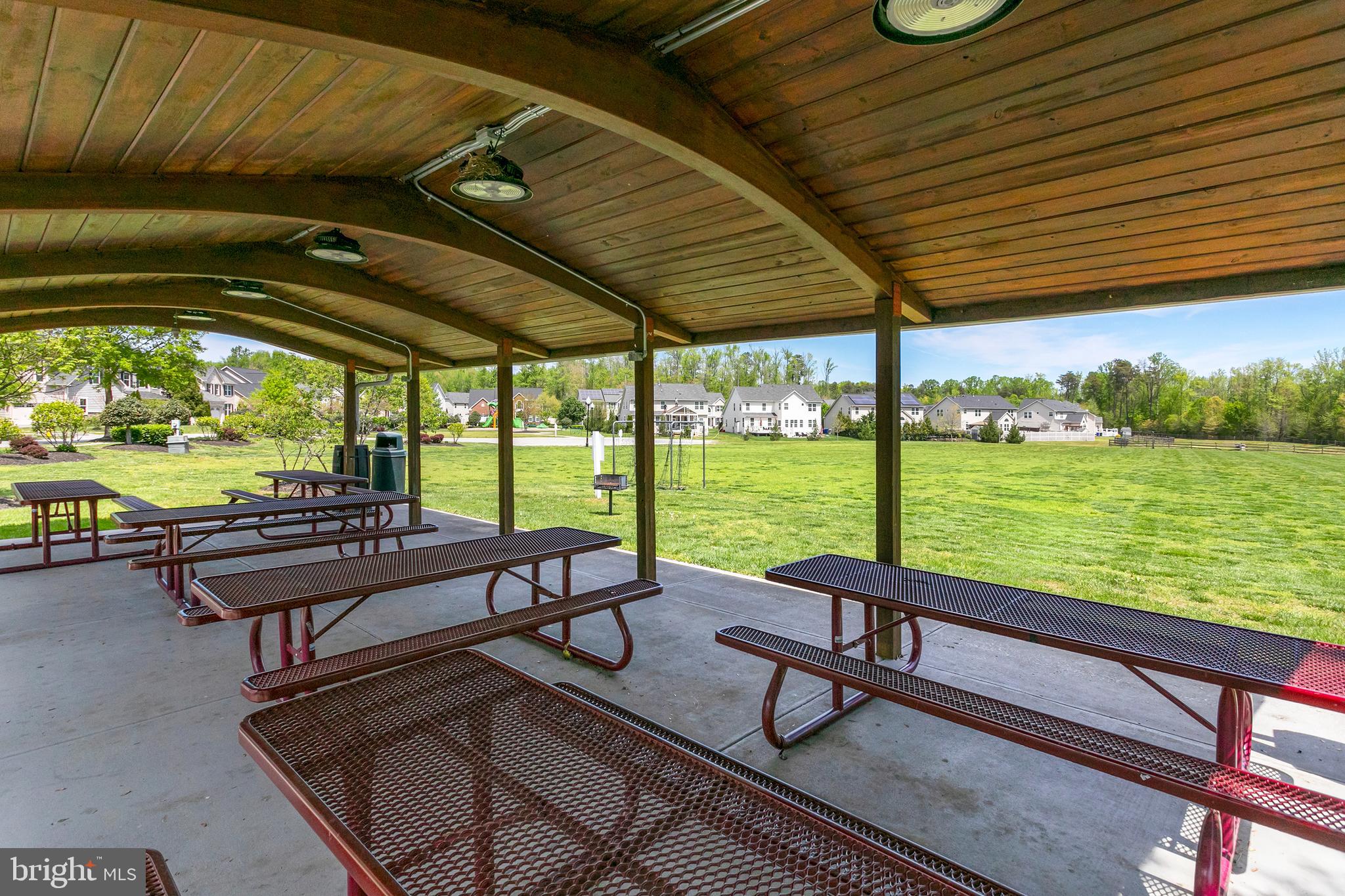 10576 Long Leaf Lane Waldorf, MD 20603 - Photo 50 of 54 a view of a patio with a table chairs and a patio