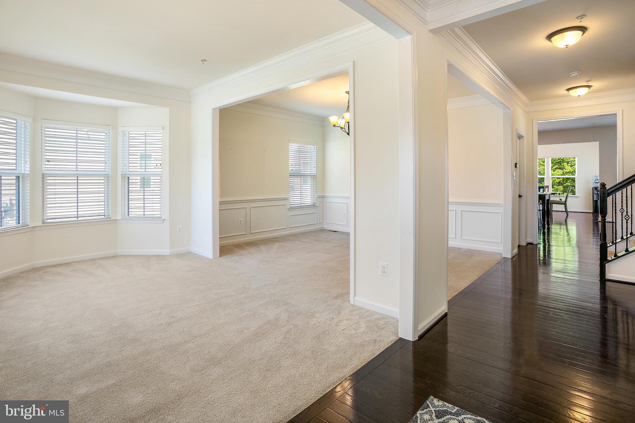 10576 Long Leaf Lane Waldorf, MD 20603 - Photo 10 of 54 wooden floor in an empty room with a window