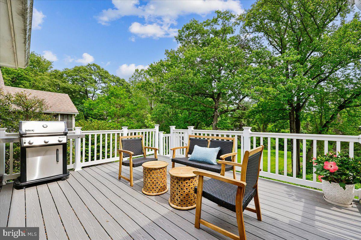 10029 Pratt Place Silver Spring, MD 20910 - Photo 18 of 36 a view of a deck with chairs on wooden deck