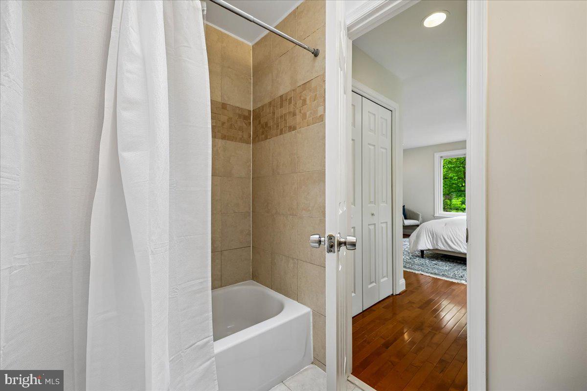 10029 Pratt Place Silver Spring, MD 20910 - Photo 24 of 36 a bathroom with a tub and shower