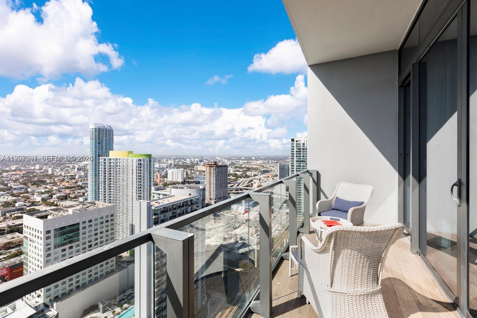 88 Southwest 7th Street, Unit 4106 Miami, FL 33130 - Photo 17 of 21 a view of a balcony with furniture