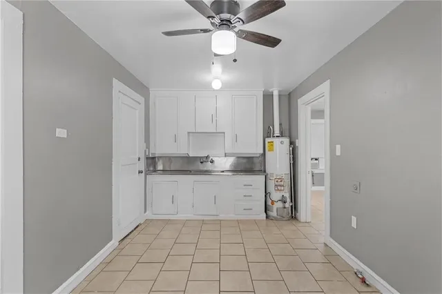 a kitchen with a sink cabinets and appliances