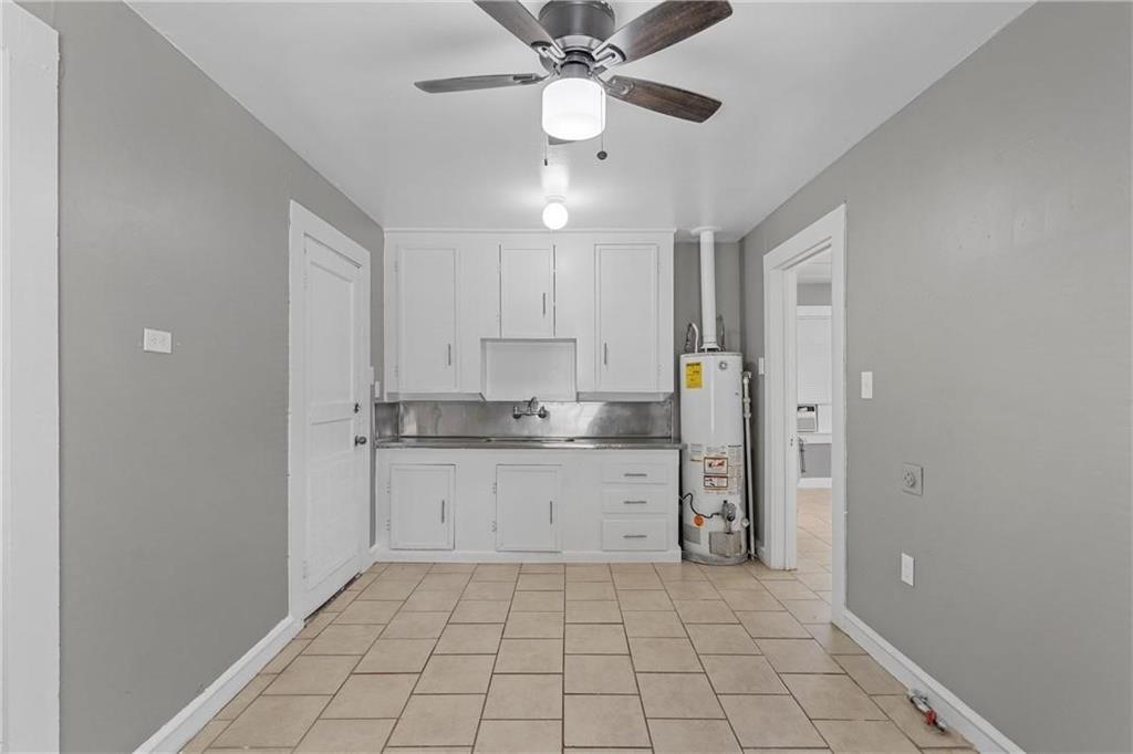 1121 Ashleman Street Waco, TX 76705 - Photo 5 of 11 a kitchen with a sink cabinets and appliances