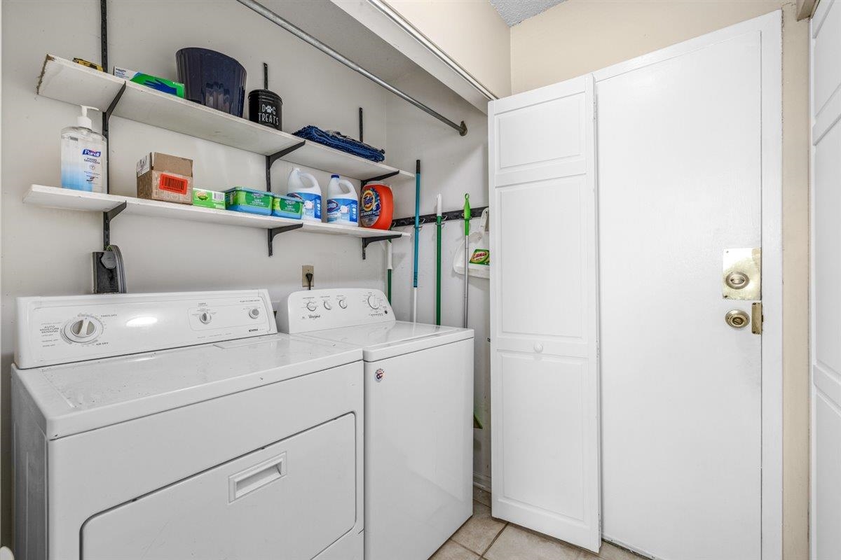2976 Kin Cove, Unit 2976 Memphis, TN 38119 - Photo 12 of 24 Dedicated laundry area featuring a white washing machine and dryer