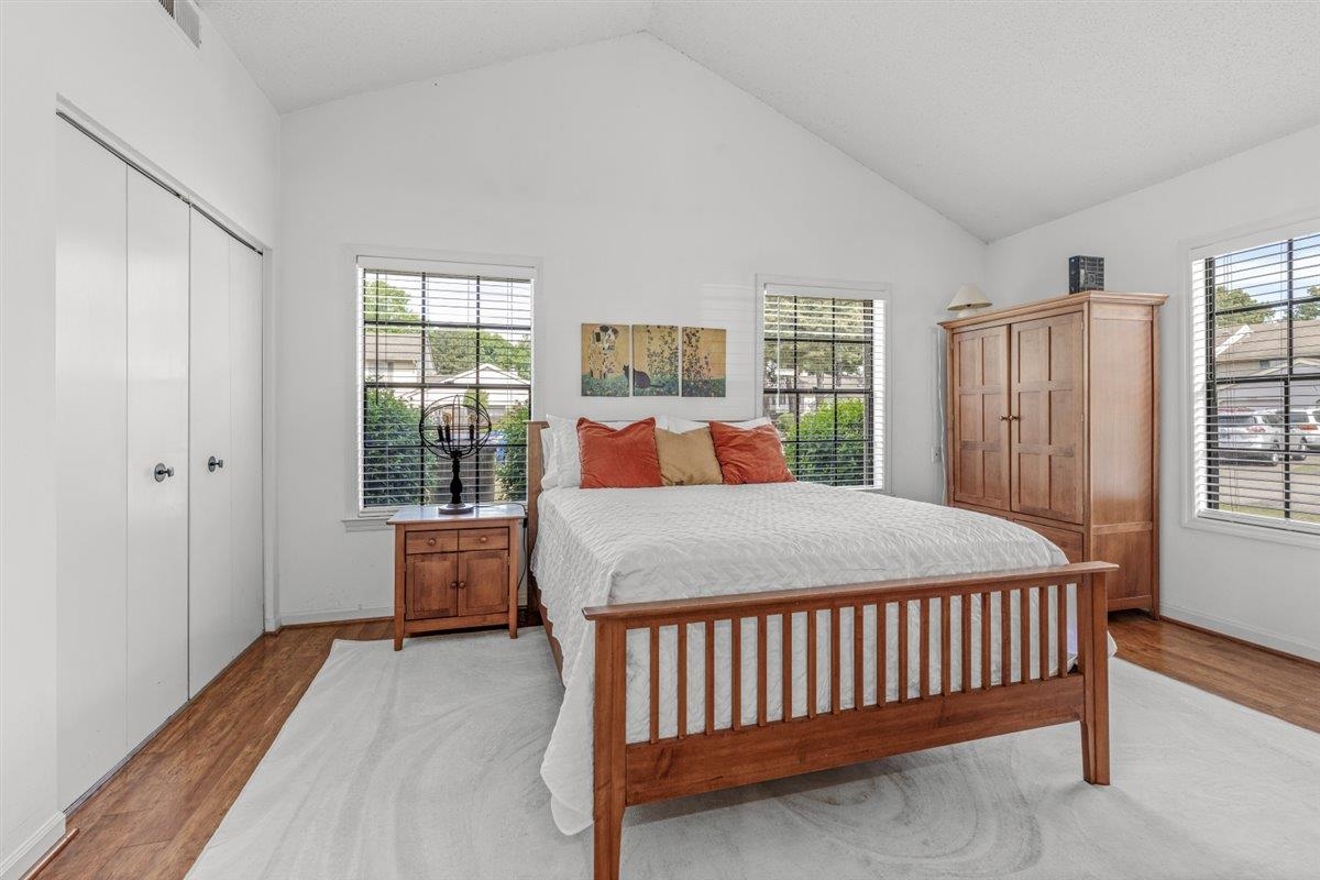2976 Kin Cove, Unit 2976 Memphis, TN 38119 - Photo 16 of 24 Bright room featuring a vaulted ceiling and wood-finish flooring