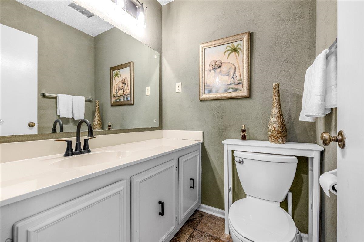 2976 Kin Cove, Unit 2976 Memphis, TN 38119 - Photo 20 of 24 Bathroom featuring a white vanity with integrated sink, black matte faucet, and matching cabinet hardware