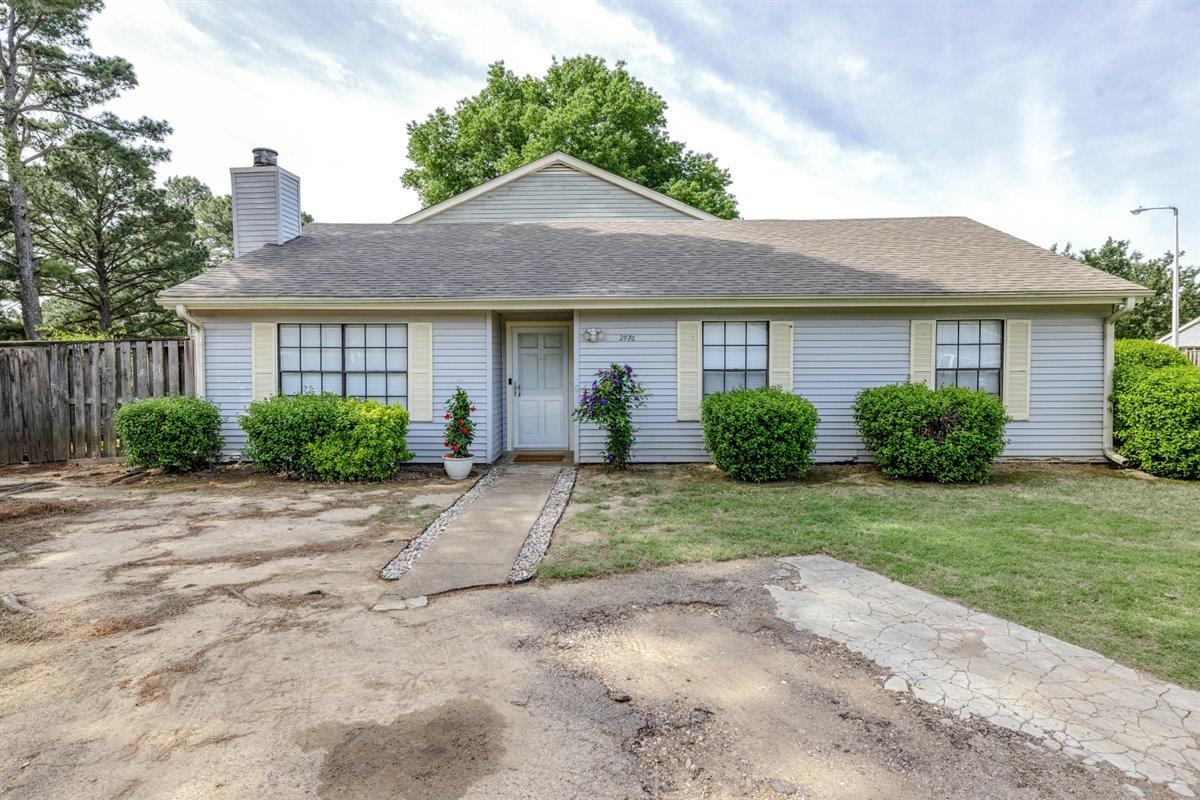 2976 Kin Cove, Unit 2976 Memphis, TN 38119 - Photo 3 of 24 Single-story residence featuring light blue siding, a grey shingle roof, and a prominent chimney