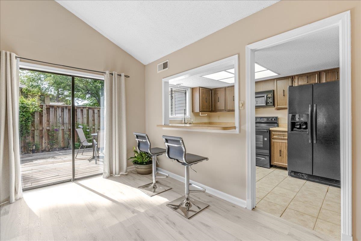 2976 Kin Cove, Unit 2976 Memphis, TN 38119 - Photo 9 of 24 Sliding glass door opening to an outdoor deck area with privacy fencing