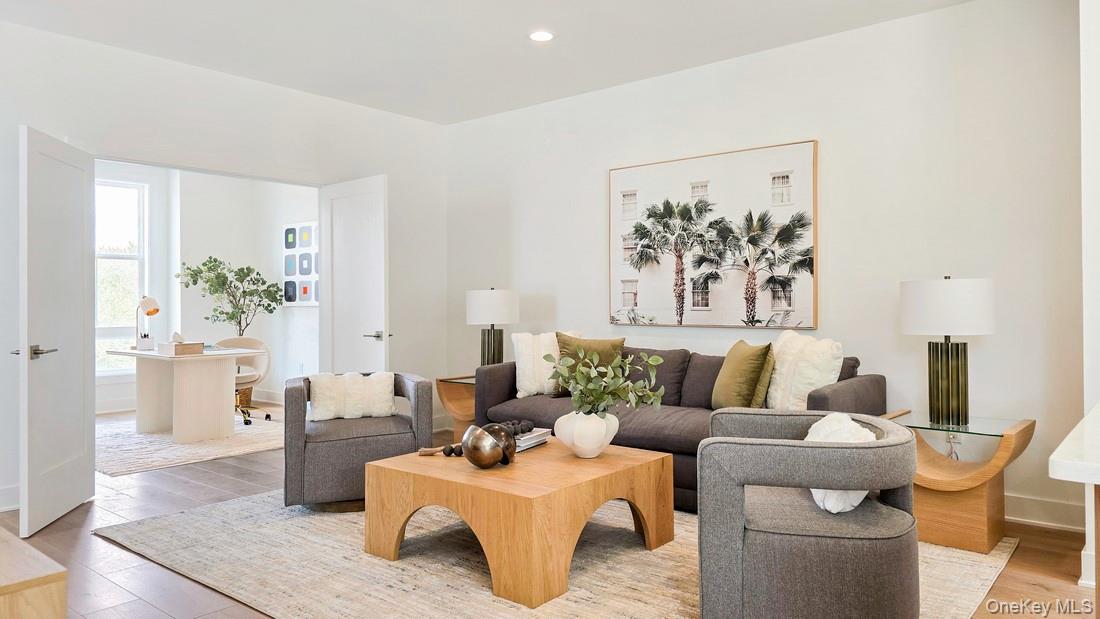 5108 Teaberry Lane, Unit 32 Fishkill, NY 12524 - Photo 2 of 4 a living room with furniture and painting on the wall