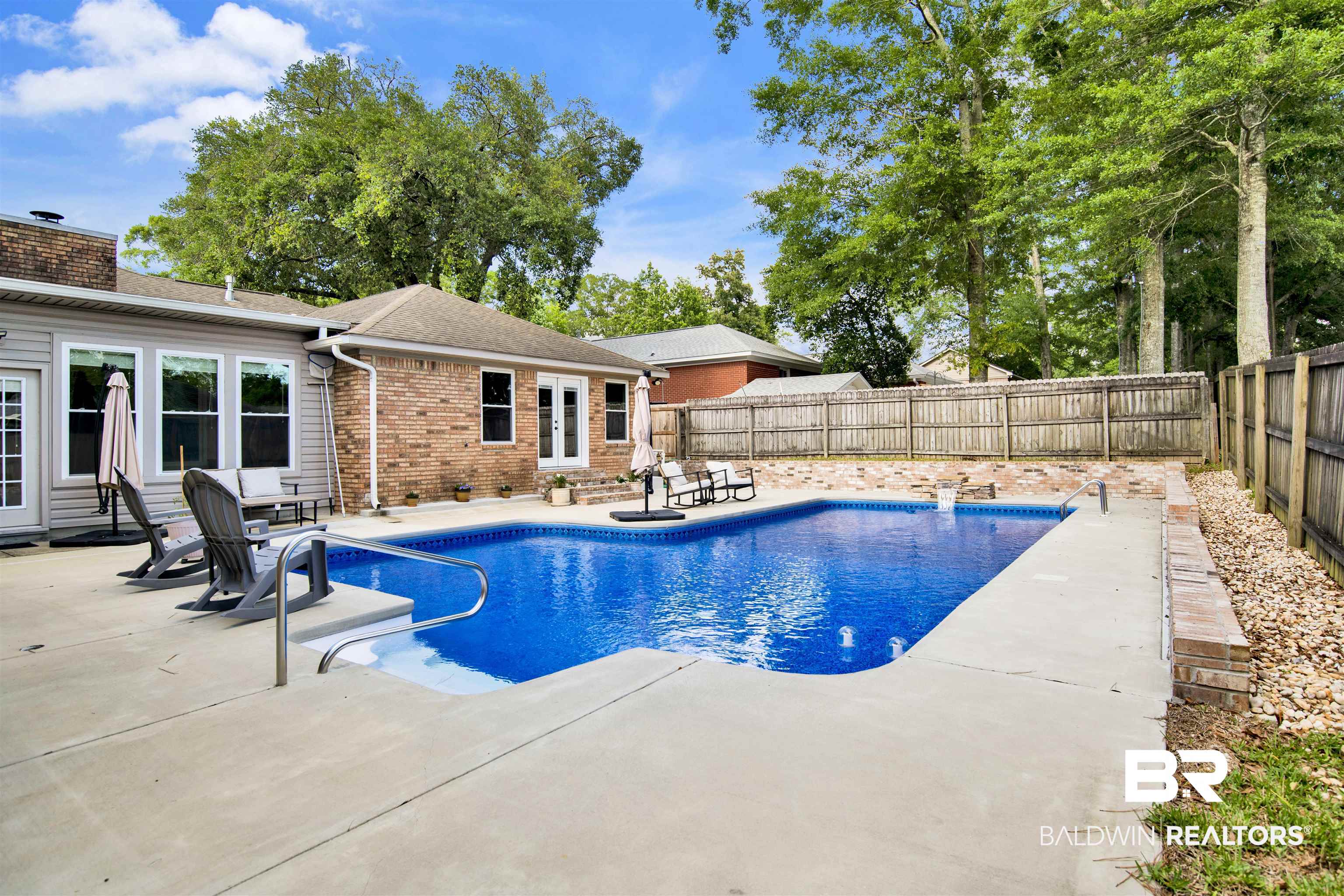 7431 Summer Court Mobile, AL 36695 - Photo 34 of 37 View of swimming pool with a patio area and a fenced backyard