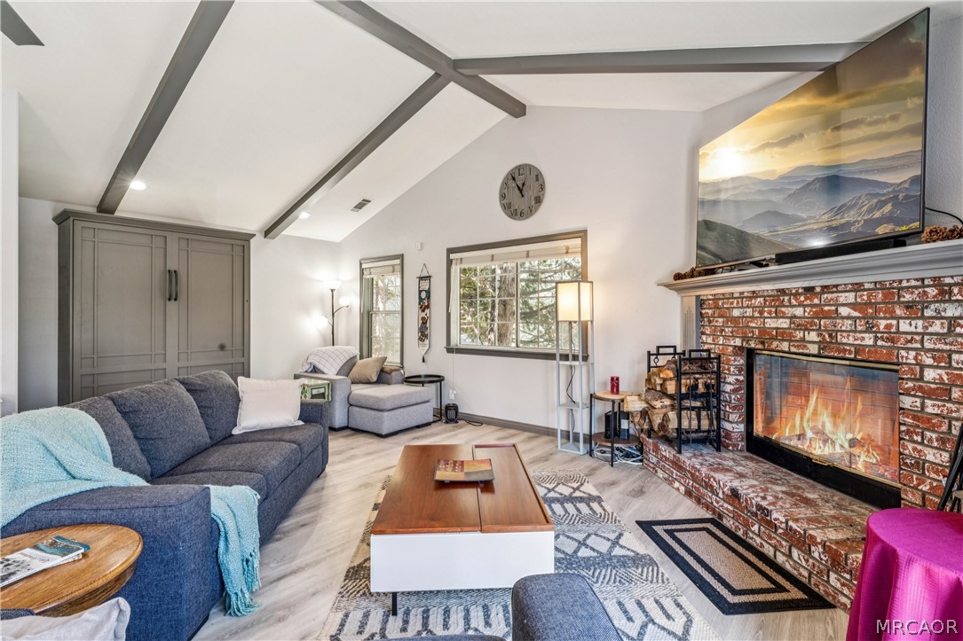 27487 North Bay Road Lake Arrowhead, CA 92352 - Photo 1 of 35 Cozy up to wood burning fireplace... note the Murphy bed! Fire is photoshopped