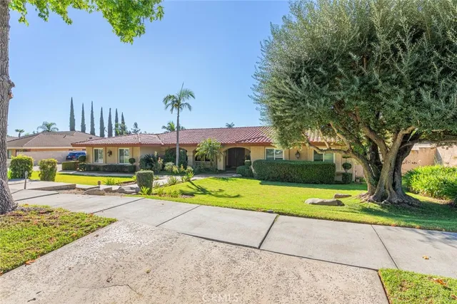 a view of swimming pool with outdoor seating and yard