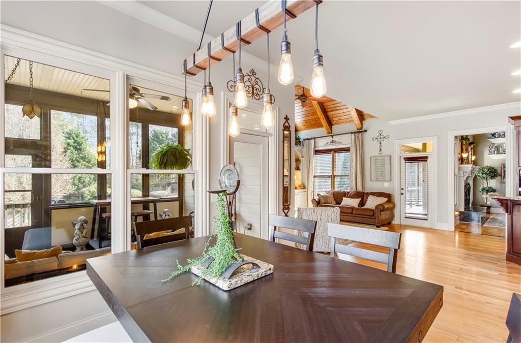 154 Gold Leaf Trail Powder Springs, GA 30127 - Photo 20 of 61 a living room with fireplace furniture and floor to ceiling windows