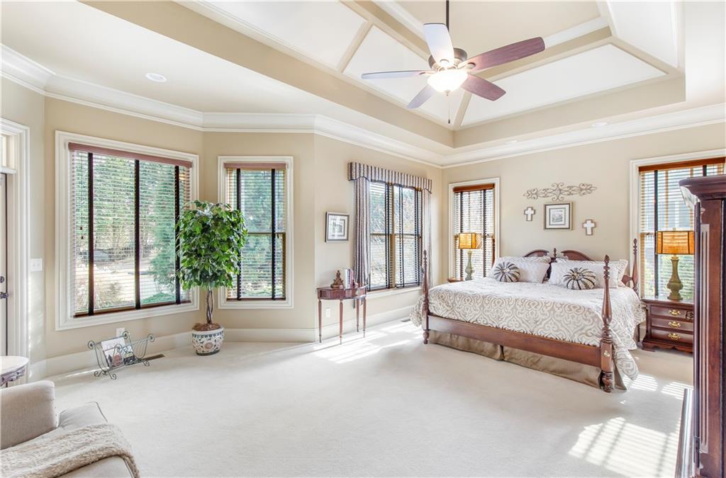 154 Gold Leaf Trail Powder Springs, GA 30127 - Photo 25 of 61 a spacious bedroom with a large bed and a large window