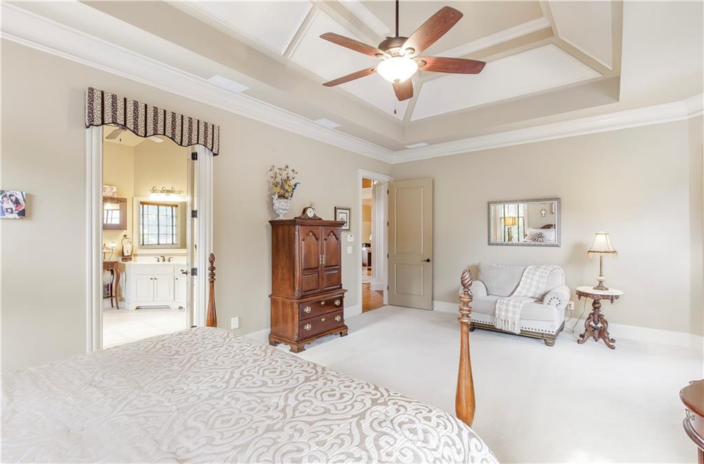 154 Gold Leaf Trail Powder Springs, GA 30127 - Photo 26 of 61 a bedroom with furniture and a chandelier