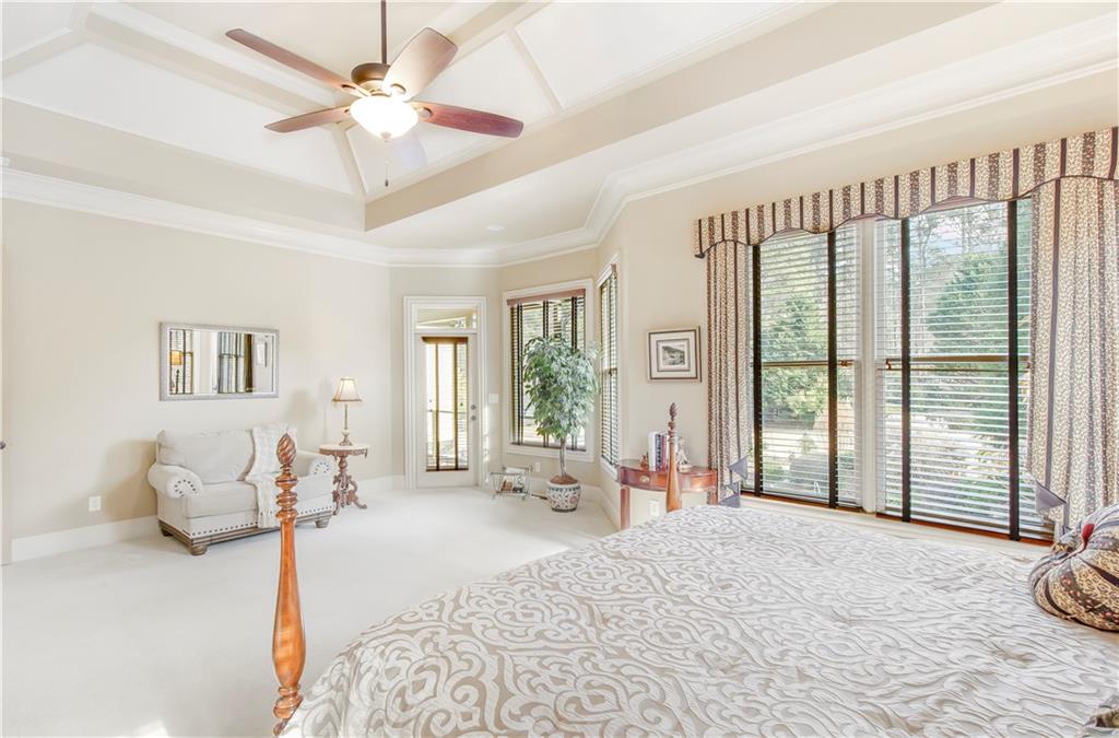 154 Gold Leaf Trail Powder Springs, GA 30127 - Photo 28 of 61 a bedroom with furniture and large windows