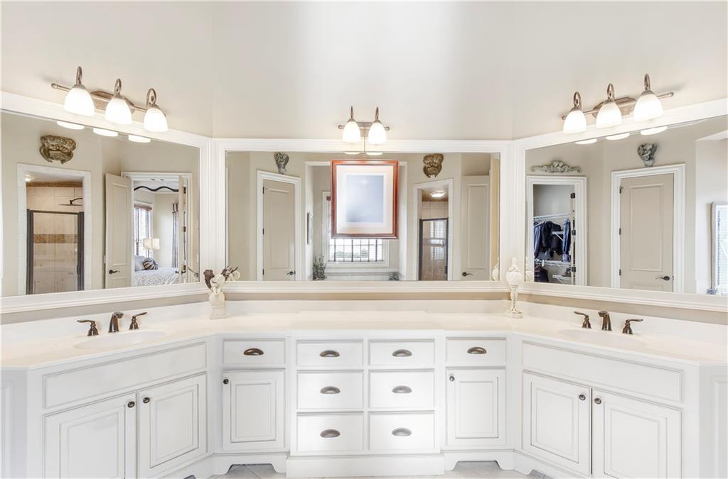 154 Gold Leaf Trail Powder Springs, GA 30127 - Photo 30 of 61 a bathroom with a sink double vanity and a mirror