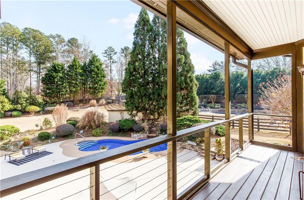 154 Gold Leaf Trail Powder Springs, GA 30127 - Photo 33 of 61 a view of a deck with wooden floor and outer view