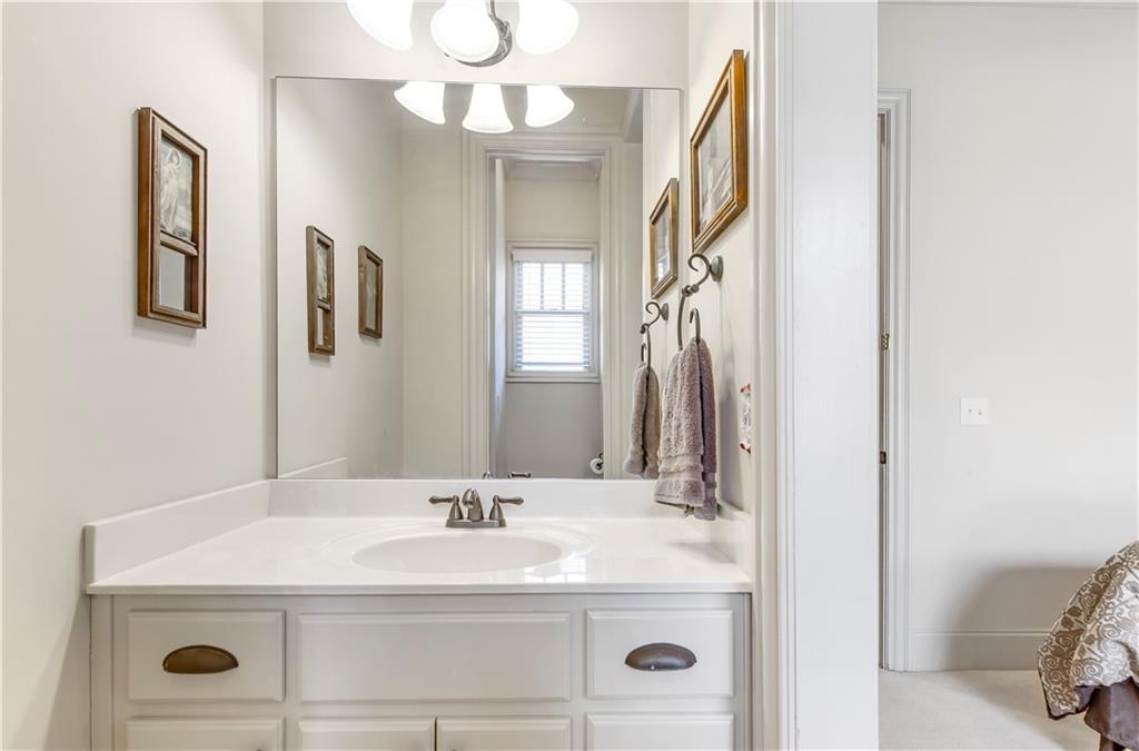 154 Gold Leaf Trail Powder Springs, GA 30127 - Photo 39 of 61 a bathroom with a sink and a mirror