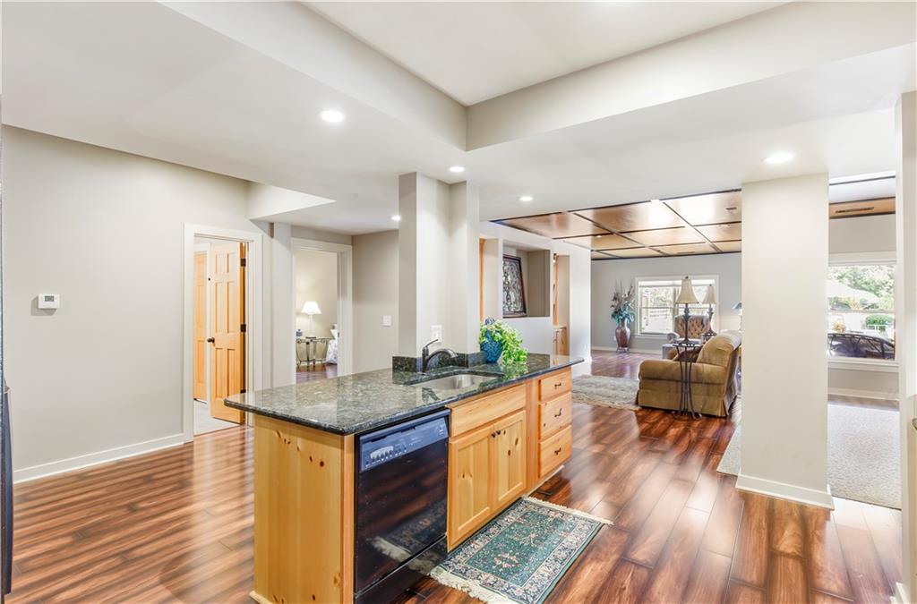 154 Gold Leaf Trail Powder Springs, GA 30127 - Photo 44 of 61 a view of living room with granite countertop furniture and wooden floor