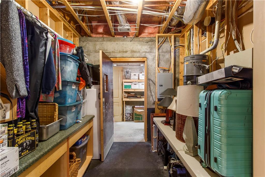 154 Gold Leaf Trail Powder Springs, GA 30127 - Photo 58 of 61 a view of walk in closet with clothes and shoes