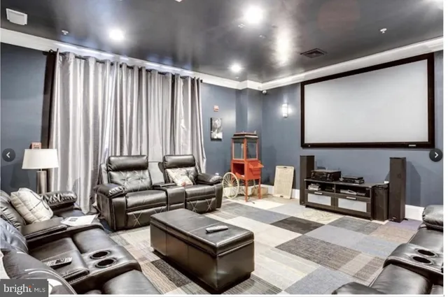 a living room with furniture a large window and a flat screen tv