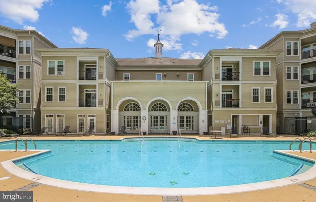 a view of pool with brick walls