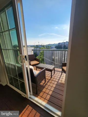 a view of a balcony with furniture