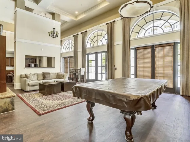 a view of a livingroom with furniture window and wooden floor