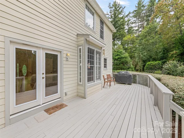 a view of balcony with furniture and wooden floor