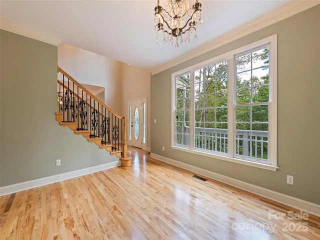 a view of an entryway with wooden floor