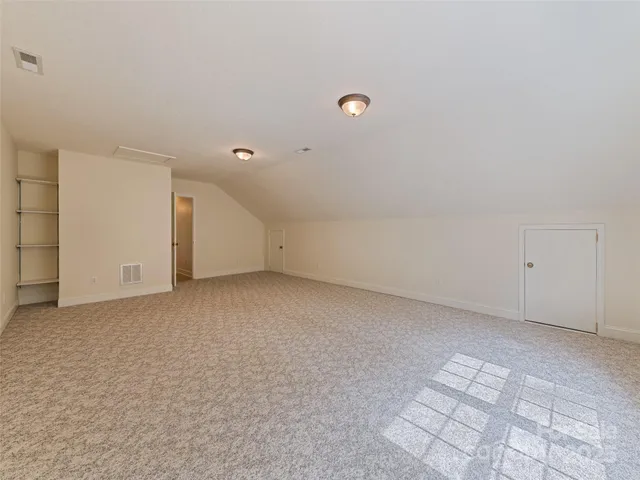 an empty room with a bathroom