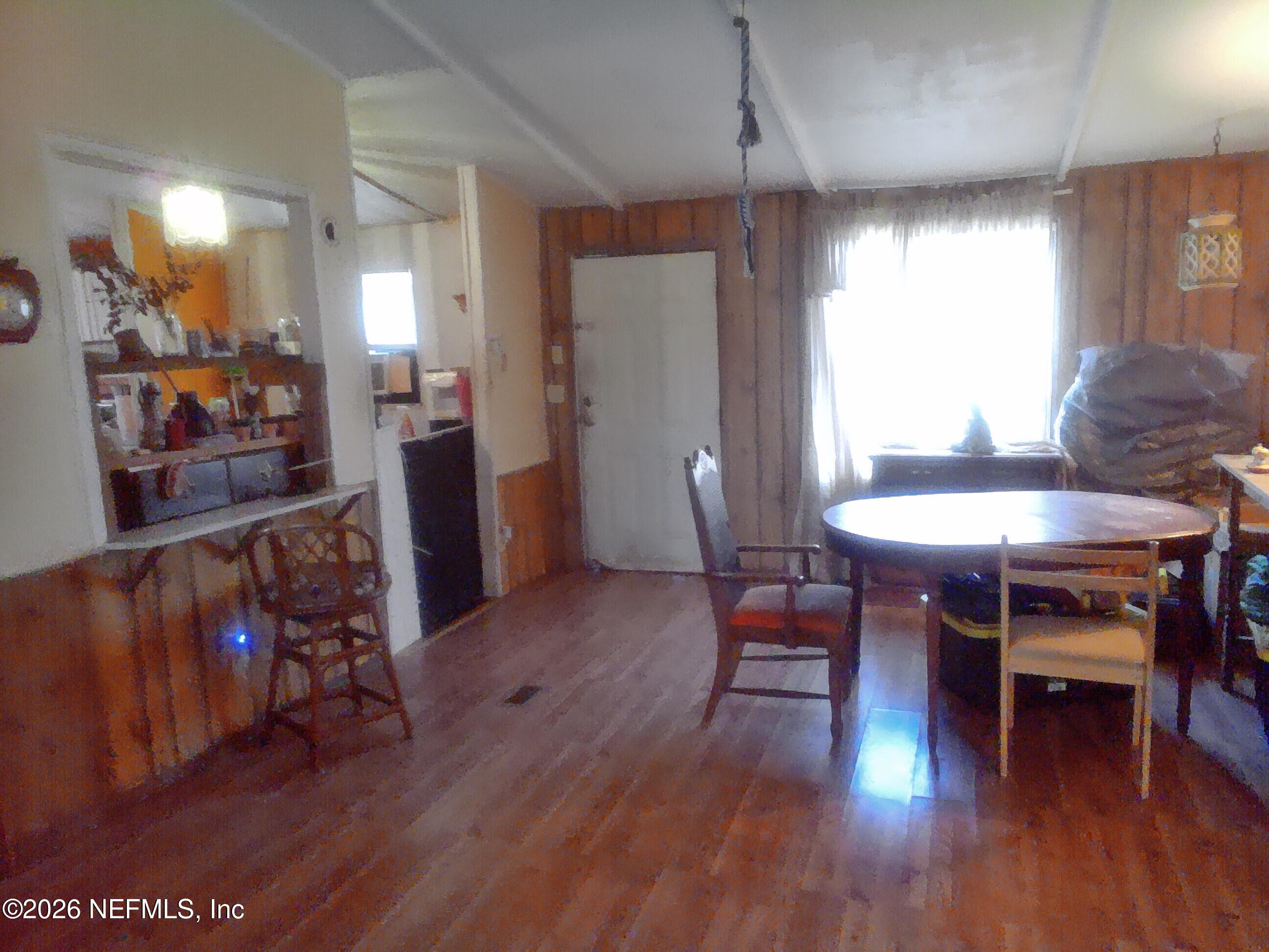 5816 Bryce Street Keystone Heights, FL 32656 - Photo 3 of 5 a dining room with furniture and wooden floor