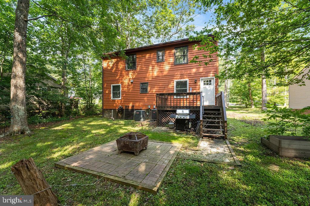 127 Saylers Creek Road Locust Grove, VA 22508 - Photo 12 of 56 a backyard of a house with seating space