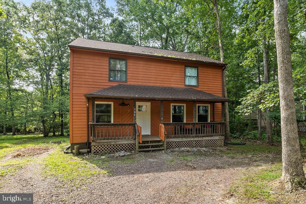 127 Saylers Creek Road Locust Grove, VA 22508 - Photo 20 of 56 a front view of a house with garden
