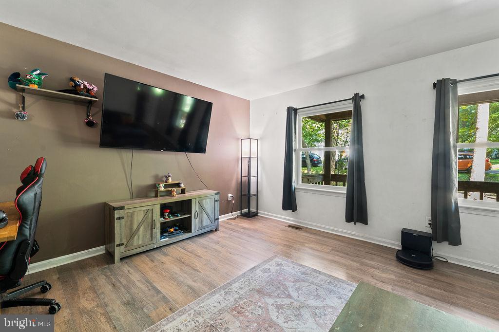 127 Saylers Creek Road Locust Grove, VA 22508 - Photo 22 of 56 a view of a livingroom with furniture and a flat screen tv