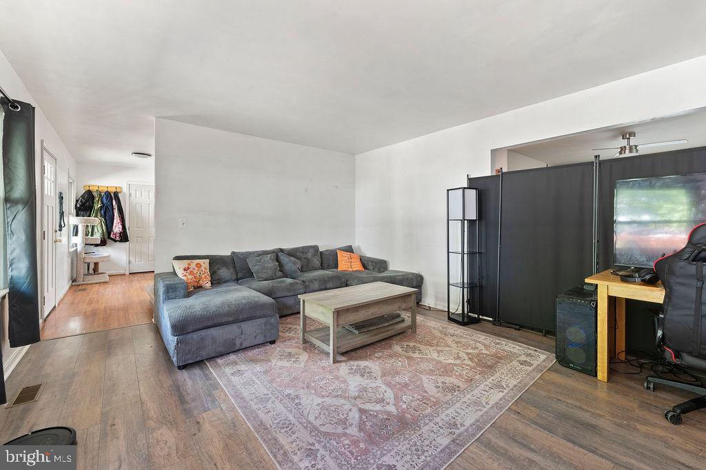 127 Saylers Creek Road Locust Grove, VA 22508 - Photo 24 of 56 a living room with furniture and a flat screen tv
