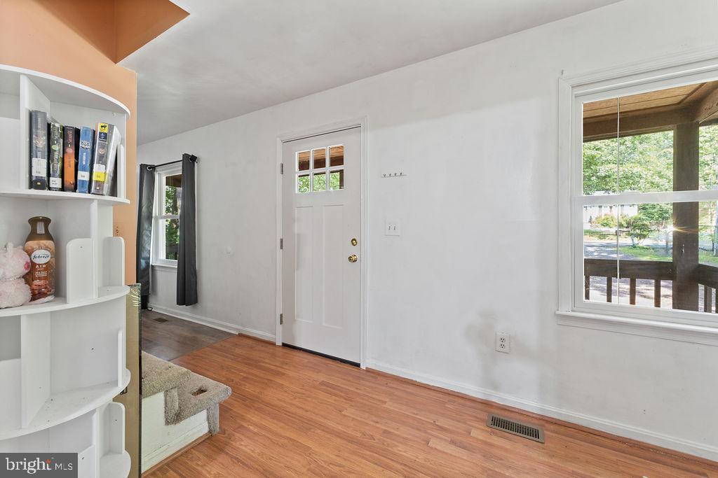 127 Saylers Creek Road Locust Grove, VA 22508 - Photo 26 of 56 a view of a bedroom with wooden floor and windows